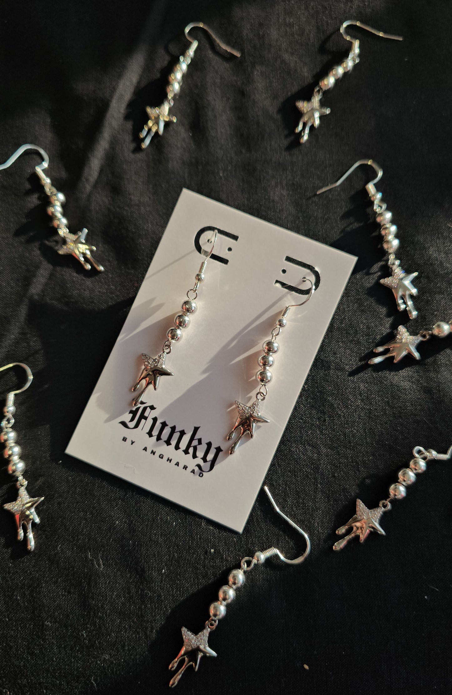 Dripping star earrings