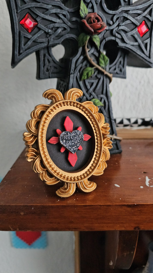 Haunted heart in gold frame