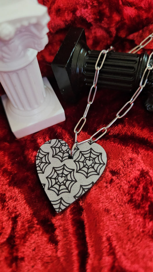 Web heart necklaces