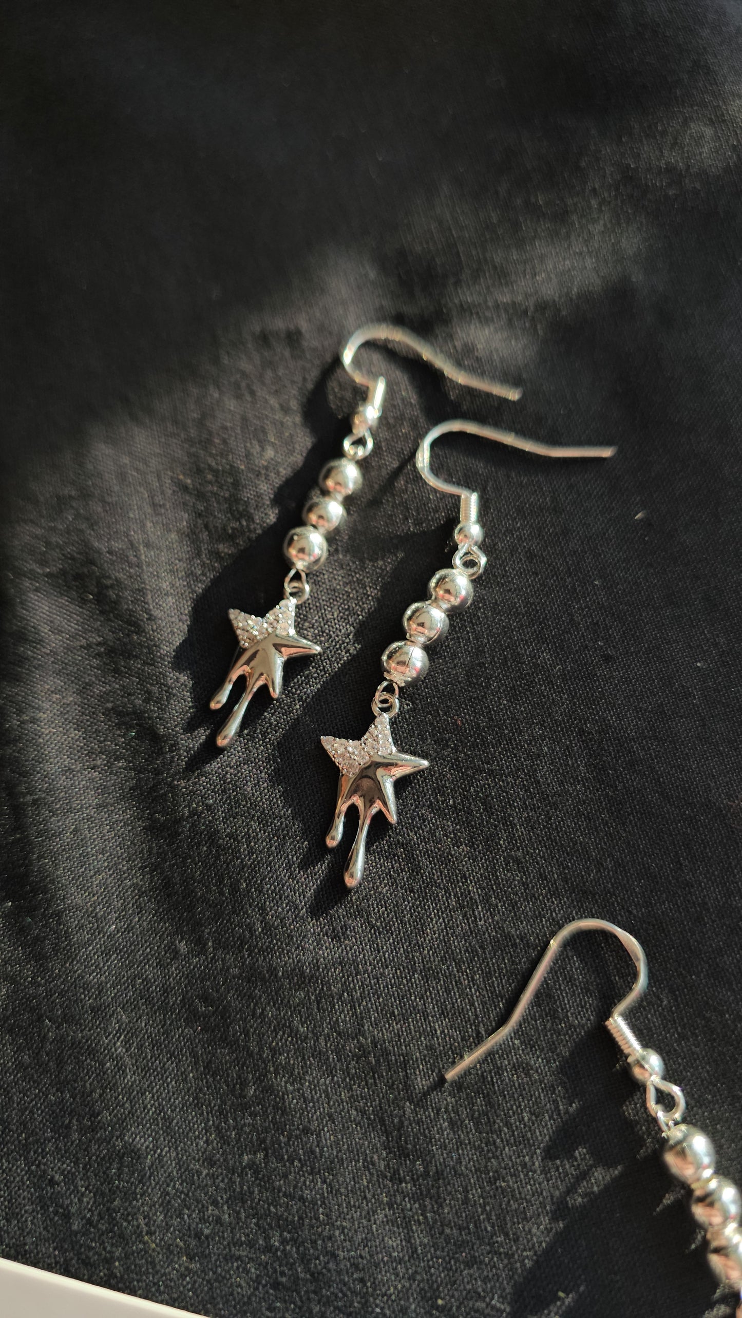 Dripping star earrings