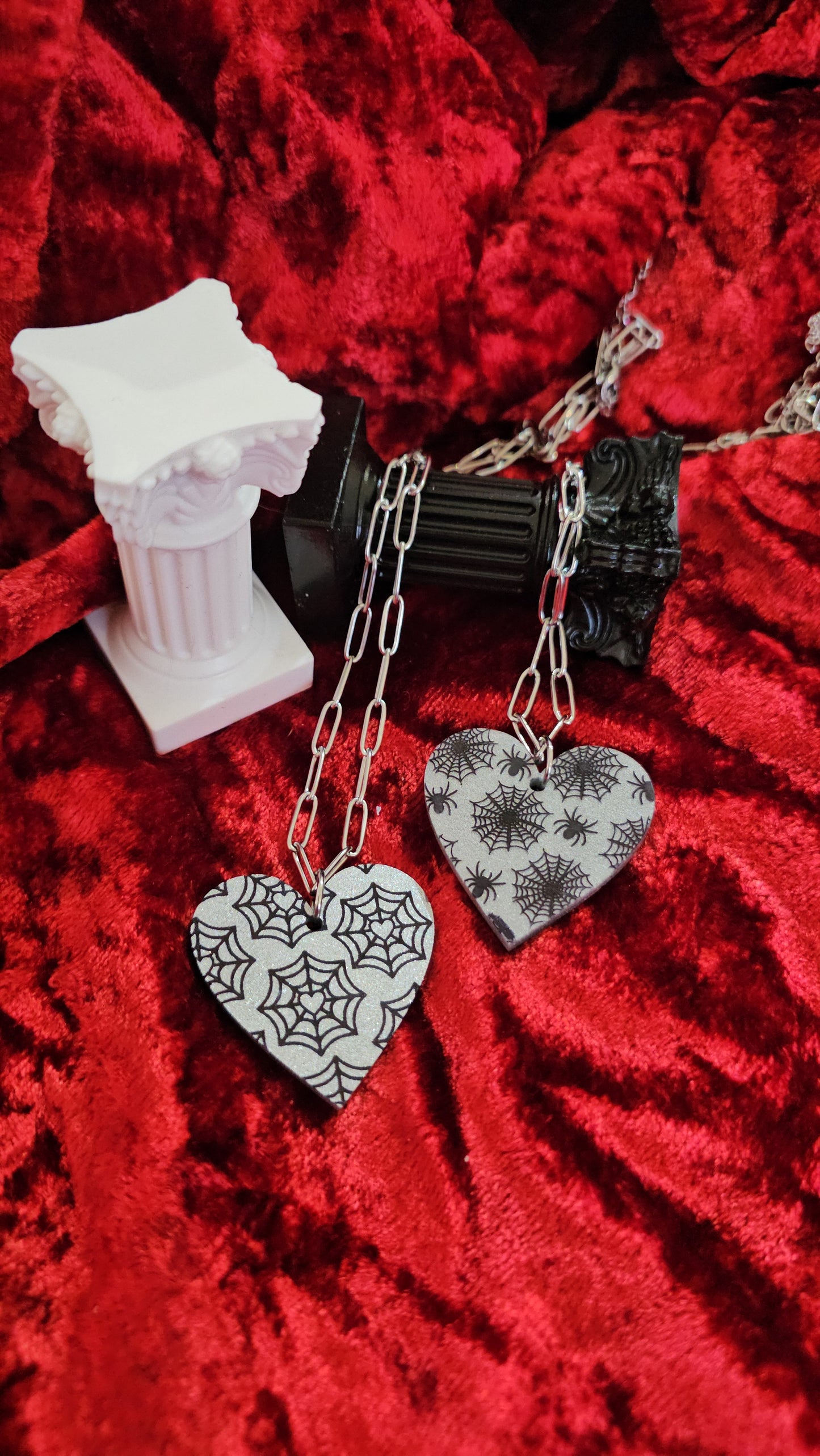 Web heart necklaces