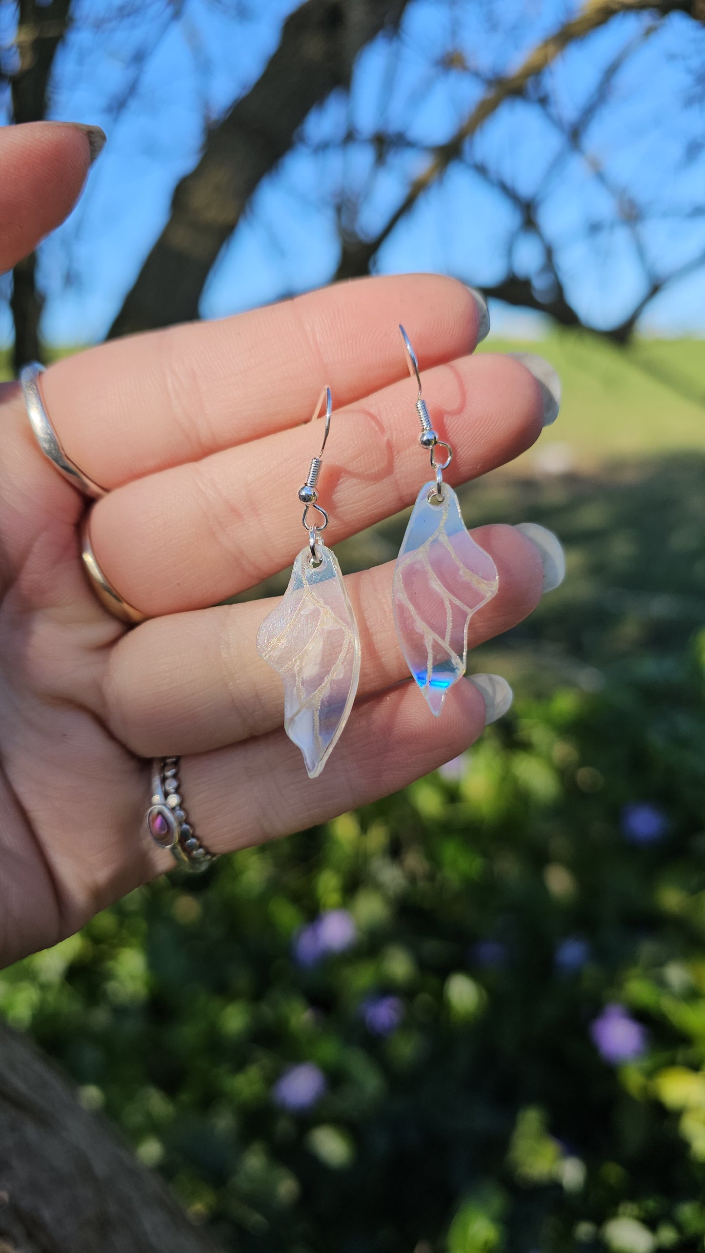 Holographic wing earrings