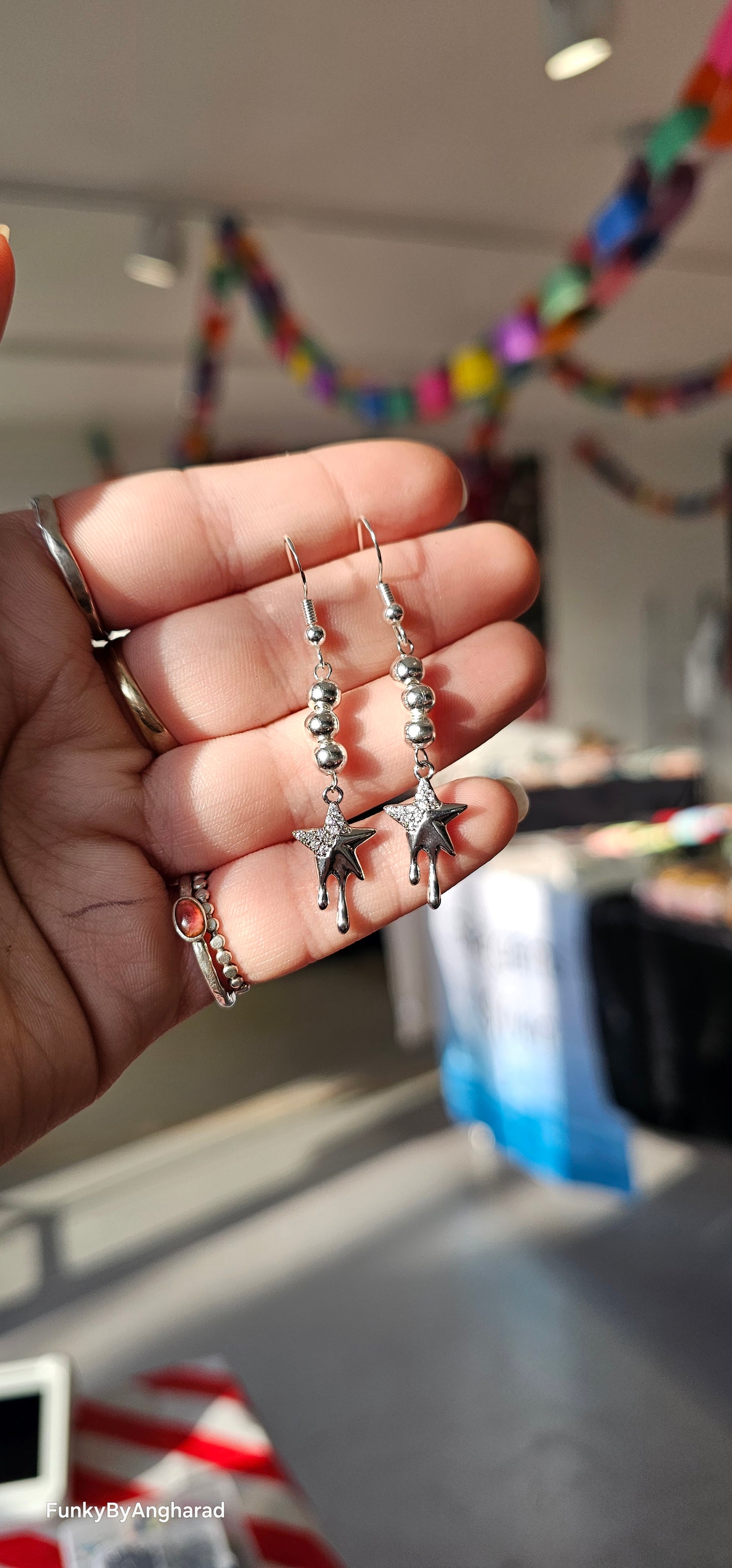 Dripping star earrings