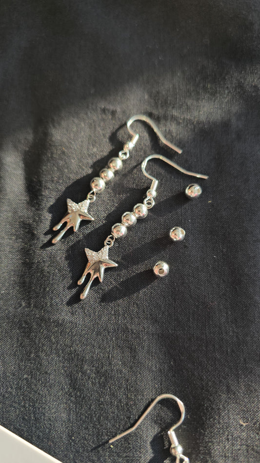 Dripping star earrings
